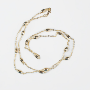 Collar de cadena fina con cuentas doradas